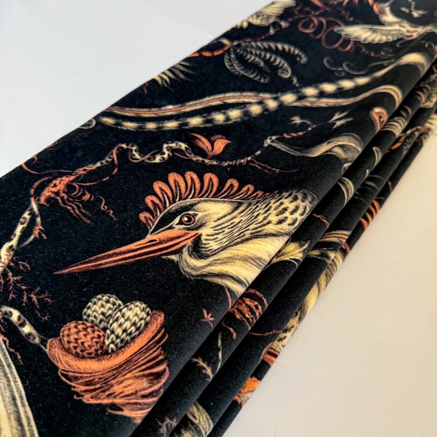 Velvet fabric Roman Blind with nature-themed design featuring birds and acorns on a dark background.