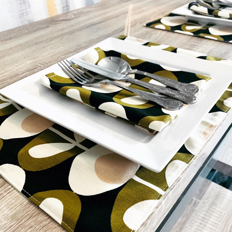 Orla Kiely Collection at Green Bee Interiors, featuring doorstops, plant pots, table linen, and kitchen towels with iconic mid-century modern patterns by British designer Orla Kiely.