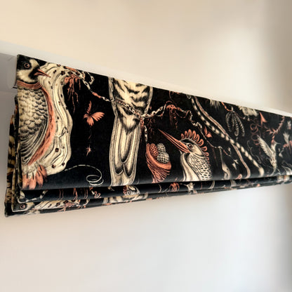 Decorative blind with bird and nature pattern on a white background