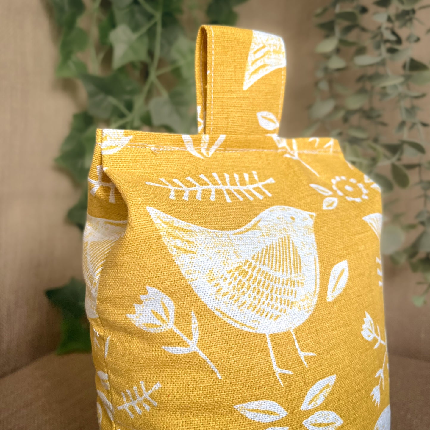 Handcrafted large yellow bird Scandinavian inspired wheat-filled door stop, crafted from high quality printed cotton. Measures 22cm tall x 15cm x 7cm at the base.