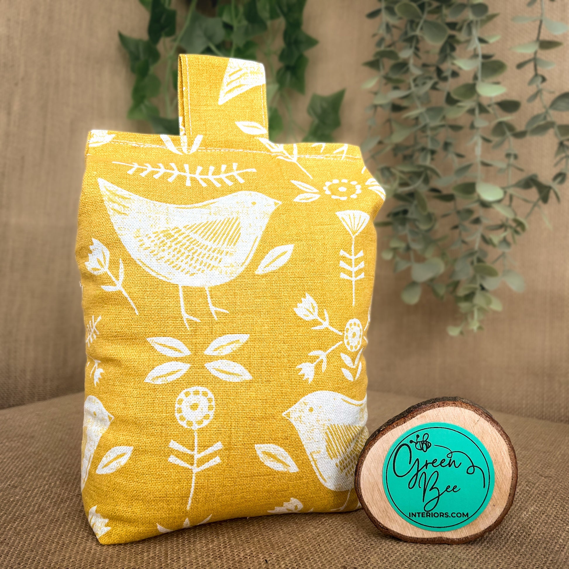 Handcrafted large yellow bird Scandinavian inspired wheat-filled door stop, crafted from high quality printed cotton. Measures 22cm tall x 15cm x 7cm at the base.