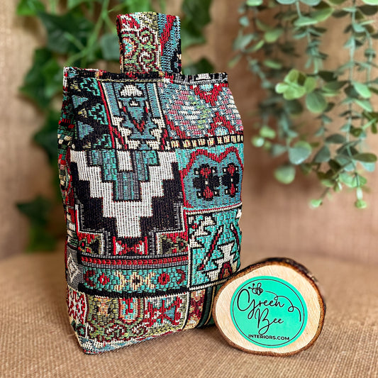 Handcrafted Moroccan-inspired wheat-filled door stop, crafted from durable woven tapestry fabric in vibrant red and blue rustic hues. Measures 22cm tall x 15cm x 7cm at the base