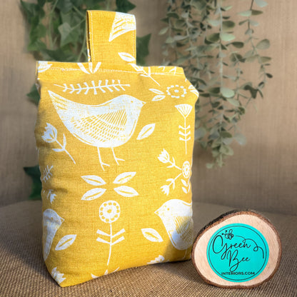 Handcrafted large yellow bird Scandinavian inspired wheat-filled door stop, crafted from high quality printed cotton. Measures 22cm tall x 15cm x 7cm at the base.