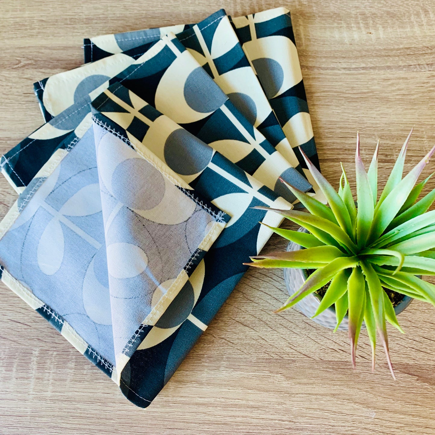 Orla Kiely grey oval table linen set including napkins, placemats, and table runners. Each piece features a sophisticated oval pattern in grey, adding a touch of modern elegance to your dining table. Perfect for creating a cohesive and stylish table setting.