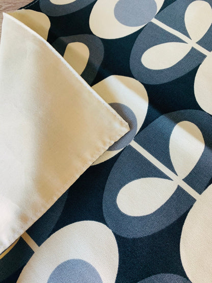 Orla Kiely grey oval table linen set including napkins, placemats, and table runners. Each piece features a sophisticated oval pattern in grey, adding a touch of modern elegance to your dining table. Perfect for creating a cohesive and stylish table setting.