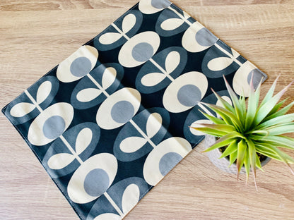 Orla Kiely grey oval table linen set including napkins, placemats, and table runners. Each piece features a sophisticated oval pattern in grey, adding a touch of modern elegance to your dining table. Perfect for creating a cohesive and stylish table setting.